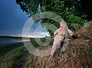 Woman on the river bank