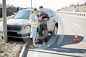 Woman with road worker during the road accident