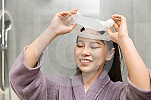 Woman in Robe Preparing for Bath or Shower