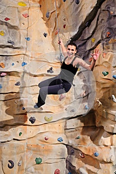 Woman on rock wall