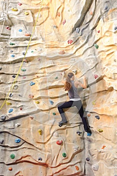 Woman on rock wall