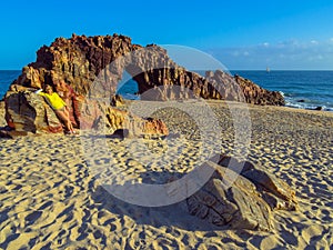 Woman on rocky beach