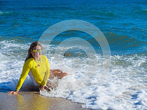 Woman on rocky beach