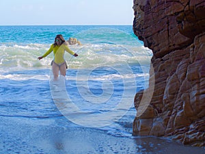 Woman on rocky beach