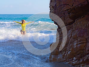 Woman on rocky beach