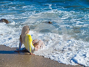 Woman on rocky beach