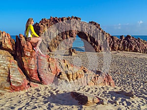 Woman on rocky beach photo