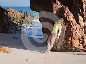 Woman on rocky beach photo