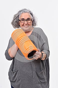 Woman with roller foan on white