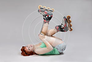 Woman on roller-skates lacing.