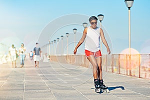 Woman, rollerskate and summer with hobby for active fitness or health for exercise. Training, fun and workout with lens