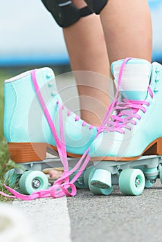 Woman rollerskater wearing knee protector pads