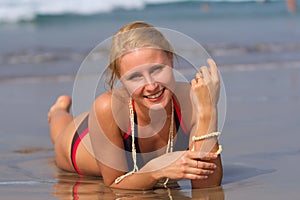 Woman rolling around in the surf