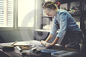 Woman Rolling Clay Craftsman Skill Concept