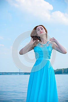 Woman in romantic blue dress, trends concept