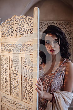 Woman in room in Moroccan style fashion harem