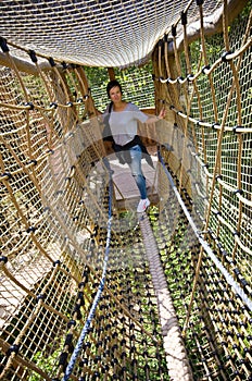 Woman on rope ladder