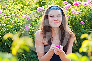 Woman in rose garden