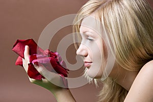 Woman with a rose petal