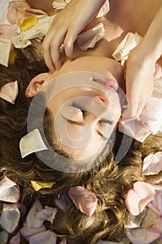 Woman with rose petals.