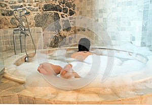 woman in a round bathtube photo