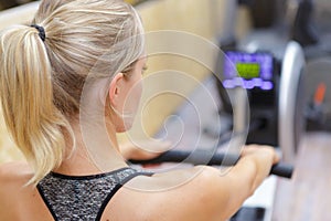 Woman on rowing machine