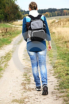 Woman with rucksack walking