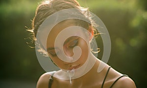 Woman run saliva from mouth, lips, makeup face photo