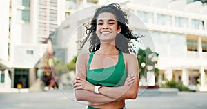 Woman, runner and arms crossed with smile in city for workout, training or health on metro street. Girl, person and