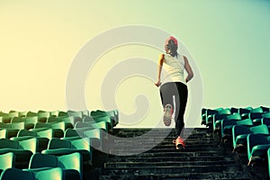 Woman runner athlete running up on stairs
