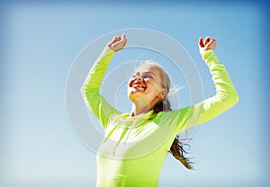 Woman runner celebrating victory