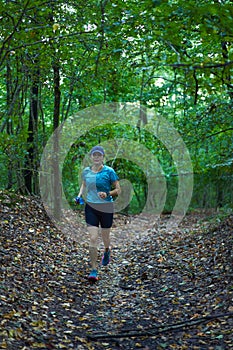 Woman runner in the forest