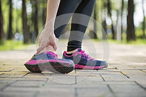 Woman runner hold twisted ankle Pain ,Human Leg