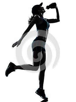 Woman runner jogger drinking silhouette