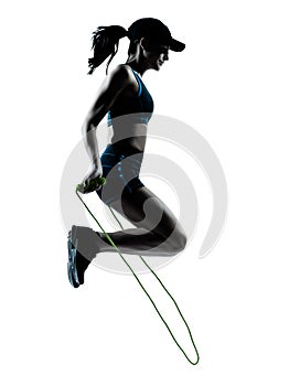 Woman runner jogger jumping rope