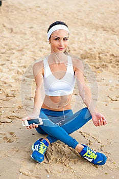 Woman runner running on the beach