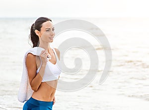 Woman runner running on the beach