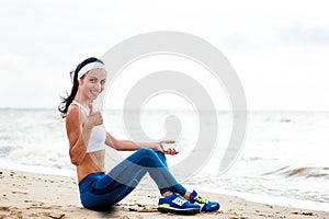 Woman runner running on the beach