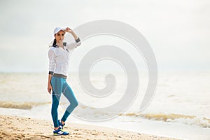 Woman runner running on the beach