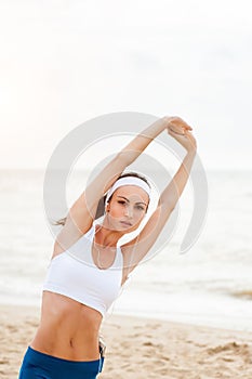 Woman runner running on the beach