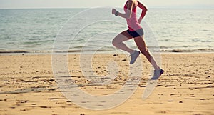 woman runner running at seaside