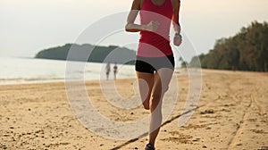 Woman runner running at seaside