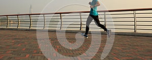 woman runner running at seaside