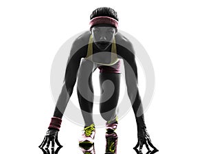 Woman runner running on starting blocks silhouette