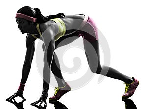 Woman runner running on starting blocks silhouette