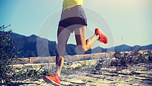 Woman runner running on the top of great wall