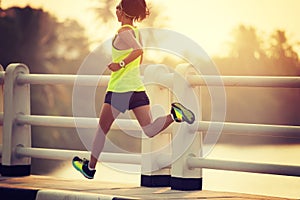 Woman runner sprinting outdoors