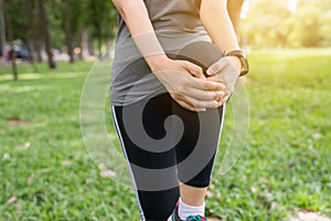 Woman runner stretching her legs before workout,Warming up muscles doing exercises
