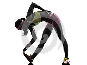 Woman runner stretching silhouette