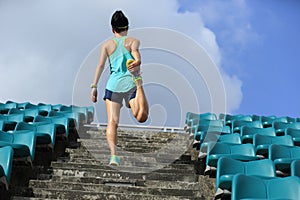 Woman runner warm up on stairs